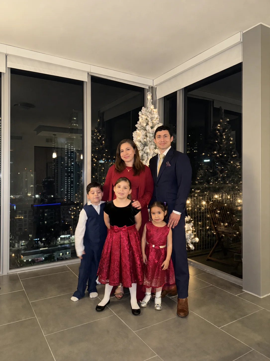 Joshua Hernandez with his wife and three children at home